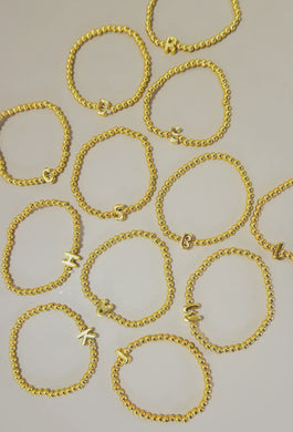 Gold beaded bubble letter bracelet