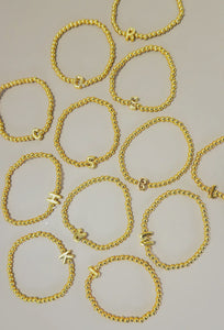 Gold beaded bubble letter bracelet