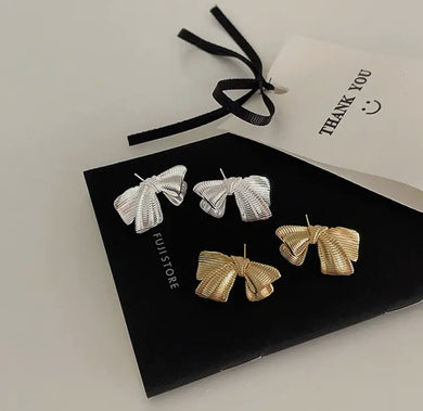 Brushed metal gold bow earrings